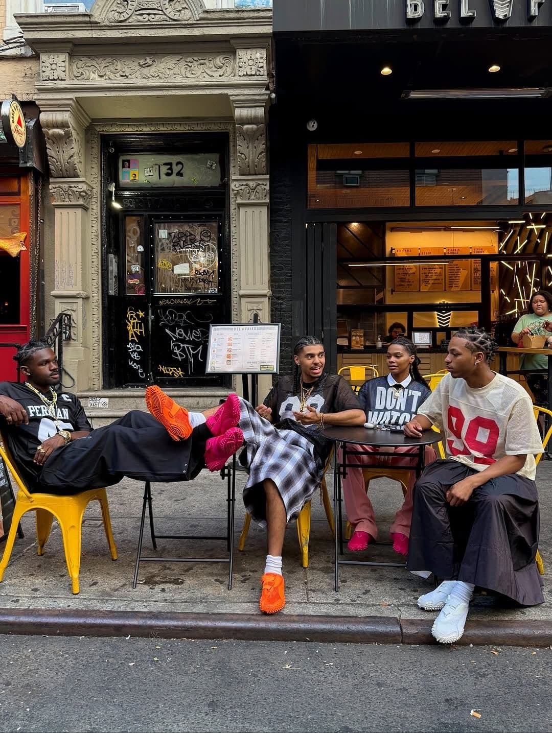 A group of friends outside a New York storefront